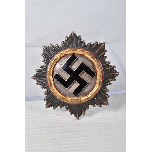 320 - A GERMAN THIRD REICH GOLD ORDER OF THE GERMAN CROSS, this cross is in good condition but shows sign ... 