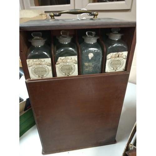 635 - AN EARLY 19TH CENTURY MAHOGANY APOTHECARY'S CABINET, with brass swan neck carrying handle to the top... 