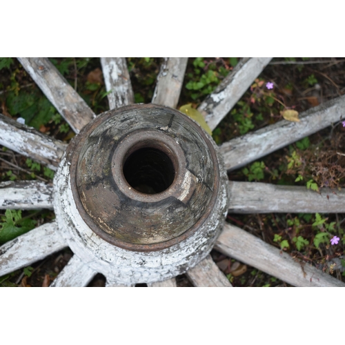 1006 - A WEATHERED CART/WAGGON WHEEL, diameter approximately 120cm (condition - weathered, losses to paint ... 