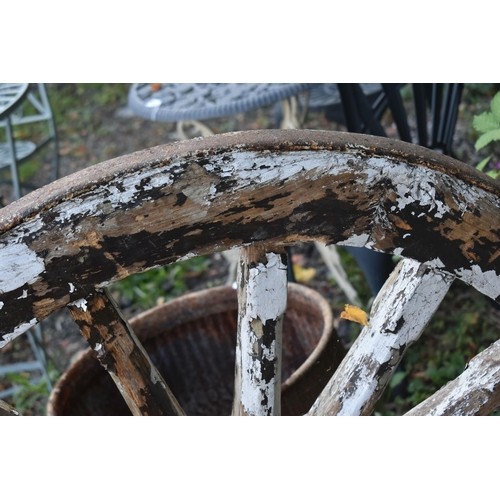 1007 - A WEATHERED CART/WAGGON WHEEL, diameter approximately 106cm (condition - weathered, losses to paint ... 