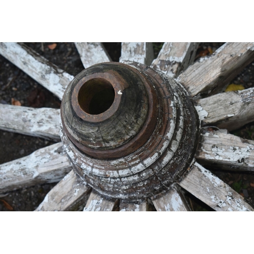 1007 - A WEATHERED CART/WAGGON WHEEL, diameter approximately 106cm (condition - weathered, losses to paint ... 