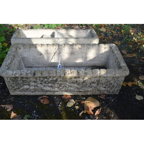 1012 - TWO COMPOSITE RECTANGULAR GARDEN PLANTERS, with branch and foliate design, largest length 71cm x dep... 