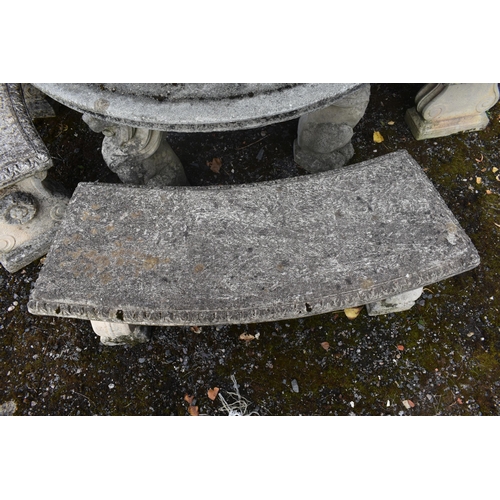 1015 - A RECONSTITUTED STONE FIVE PIECE GARDEN SUITE, comprising a circular table that rests on three seate... 