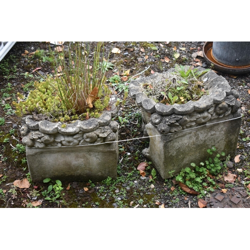 1026 - A PAIR OF COMPOSITE GARDEN PLANTERS, with scrolled and shell style design, length 53cm x width 38cm ... 