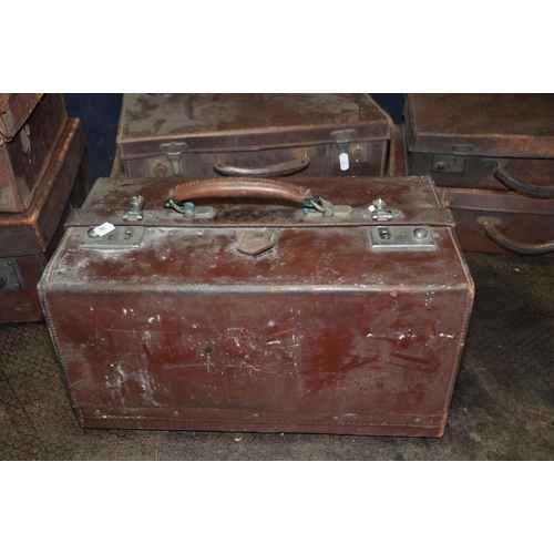 1051 - A COLLECTION OF SEVEN LEATHER CASES comprising of a suitcase width 66cm x depth 36cm x height 17cm w... 