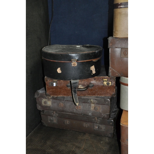 1052 - TWELVE ITEMS OF VINTAGE LUGGAGE including eight fibre suitcases, a tweed and leatherette 'Watajoy' c... 