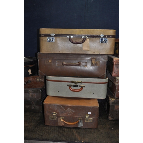 1052 - TWELVE ITEMS OF VINTAGE LUGGAGE including eight fibre suitcases, a tweed and leatherette 'Watajoy' c... 