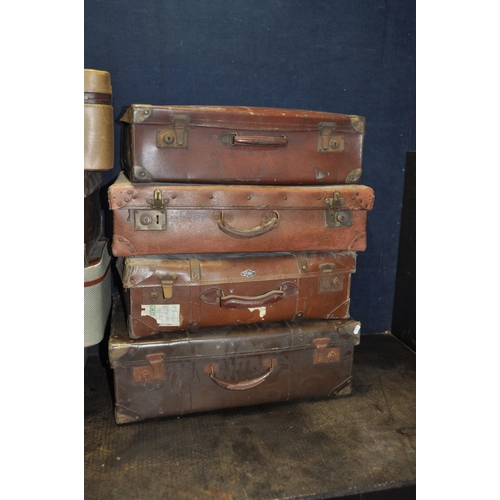 1052 - TWELVE ITEMS OF VINTAGE LUGGAGE including eight fibre suitcases, a tweed and leatherette 'Watajoy' c... 