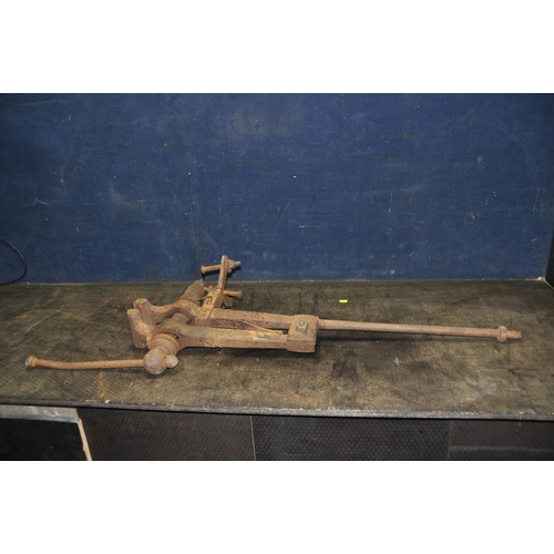 1056 - A VINTAGE CAST IRON LEG VICE length 105cm (Condition rusty and may need attention to be usable)