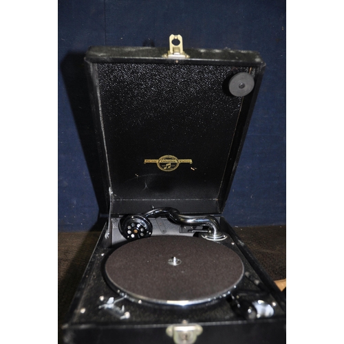 1092 - A COLUMBIA TABLETOP WIND UP GRAMAPHONE with black leather effect covering and three 12in 78s (Condit... 