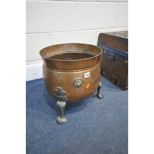 1202 - A COPPER CAULDRON, on triple claw legs, diameter 36cm x height 36cm, along with a tin trunk, a canva... 