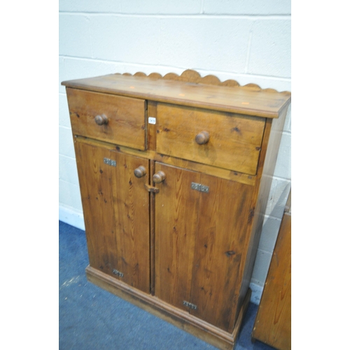 1210 - A STAINED PINE TWO DOOR CABINET, with two drawers, width 97cm x depth 40cm x height 130cm, a stained... 