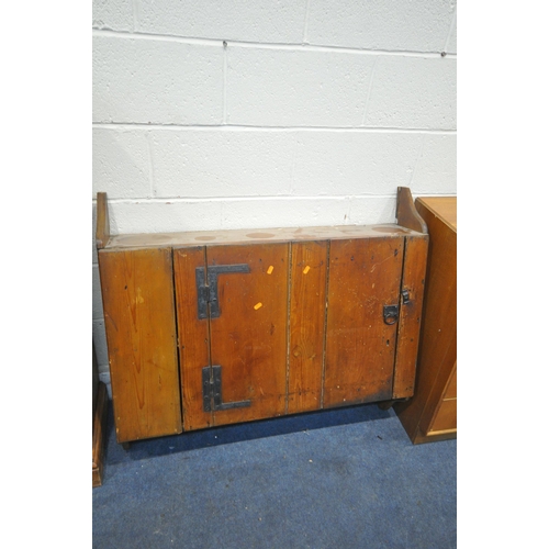 1210 - A STAINED PINE TWO DOOR CABINET, with two drawers, width 97cm x depth 40cm x height 130cm, a stained... 