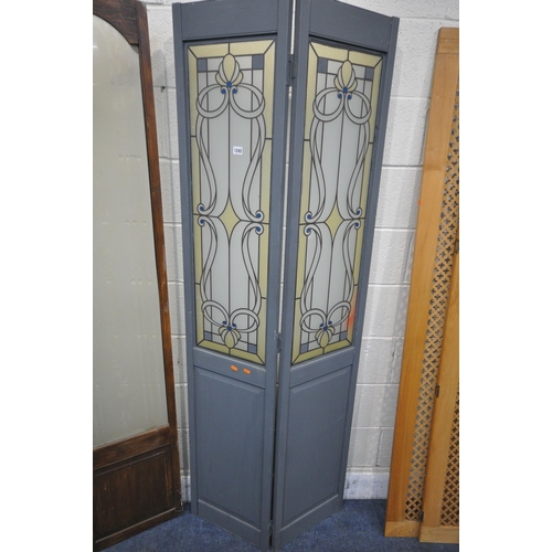 1242 - TWO GLAZED TWO PANEL FLOOR SCREENS, one painted with Art Nouveau glazing, the other with frosted gla... 