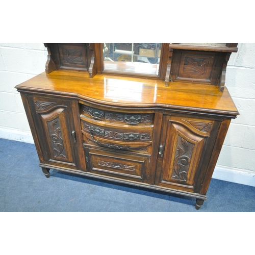 1251 - AN EDWARDIAN WALNUT MIRRORBACK, with an arrangement of mirrors, drawers and cupboard, width 149cm x ... 