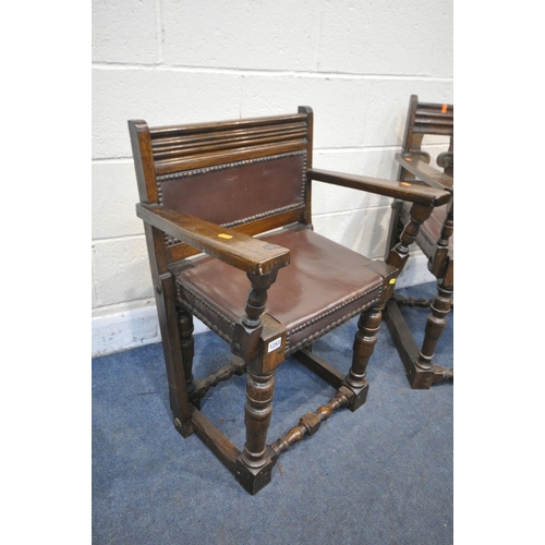 1253 - TWO SIMILAR STAINED OAK TUDOR STYLE OPEN ARMCHAIRS, with studded seats (condition report: frames sol... 