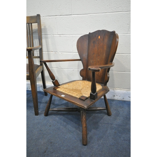 1254 - AN OAK GOTHIC OPEN ARMCHAIR, with a rush seat, along with a Heals of London style open armchair (con... 