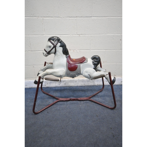 1265 - A VINTAGE SPRUNG CHILDS ROCKING HORSE (condition report: missing handles, well used condition)