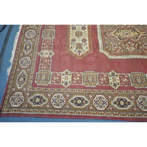 1274 - A LARGE WOOLLEN FLORAL RED AND GOLD RUG, 338cm x 247cm, and a blue wool carpet runner (condition rep... 