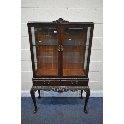 1279 - AN VICTORIAN STYLE MAHOGANY TWO DOOR DISPLAY CABINET, with two glass shelves and two drawers, on cab... 