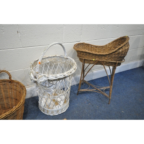 1289 - A SELECTION OF WICKER BASKETS, to include a crib on stand, five handled baskets, etc (condition repo... 