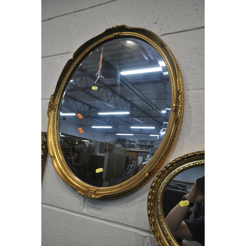 1294 - AN ATTWELL GILT WOOD FRAMED BEVELLED EDGE WALL MIRROR, a gilt and ebonised wall mirror, a rectangula... 