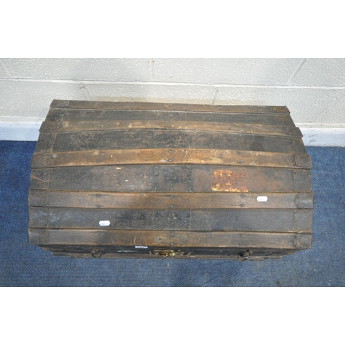 1297 - A VINTAGE WOOD AND METAL BANDED DOME TOP TRUNK, width 73cm x depth 43cm x height 51cm (condition - h... 