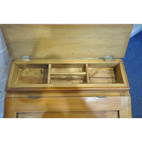 1298 - A REPRODUCTION PINE DAVENPORT, with a hinged lid and storage compartment, and four drawers to right ... 