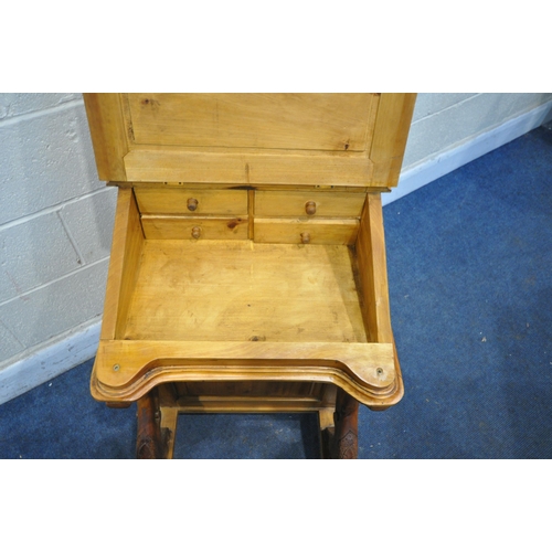 1298 - A REPRODUCTION PINE DAVENPORT, with a hinged lid and storage compartment, and four drawers to right ... 