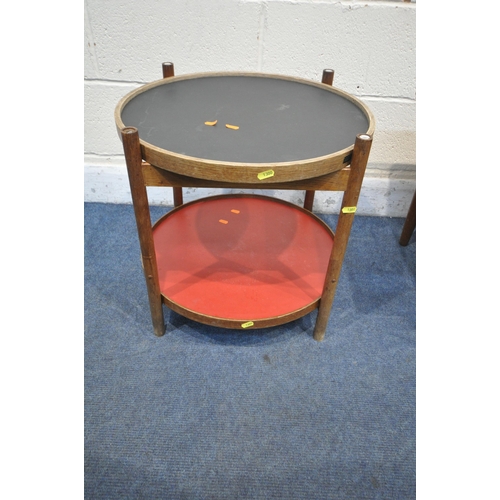 1300 - A MID-CENTURY TORBEN ORSKOV & CO TEAK CIRCULAR TWO TIER FOLDING SIDE TABLE, with two coloured trays,... 