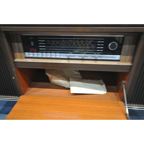 1301 - A MID-CENTURY GRUNDIG RADIOGRAM, with a turntable and stereo, on square tapered legs, length 147cm x... 