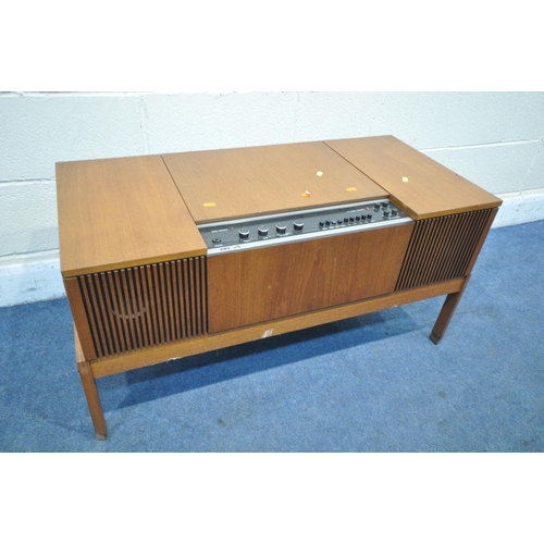 1301 - A MID-CENTURY GRUNDIG RADIOGRAM, with a turntable and stereo, on square tapered legs, length 147cm x... 