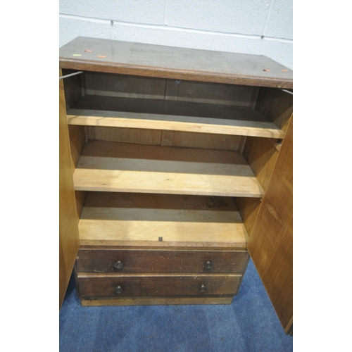 1305 - AN EARLY TO MID 20TH CENTURY OAK TWO DOOR CABINET, with two drawers, width 84cm x depth 47cm x heigh... 