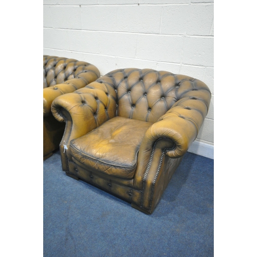 1314 - A MUSTARD LEATHER TWO PIECE CHESTERFIELD LOUNGE SUITE, comprising a three seater settee, length 200c... 