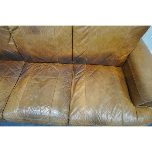 1315 - A TAN STUDDED LEATHER THREE SEATER SETTEE, length 184cm (condition report: cracks to arm rests, seat... 