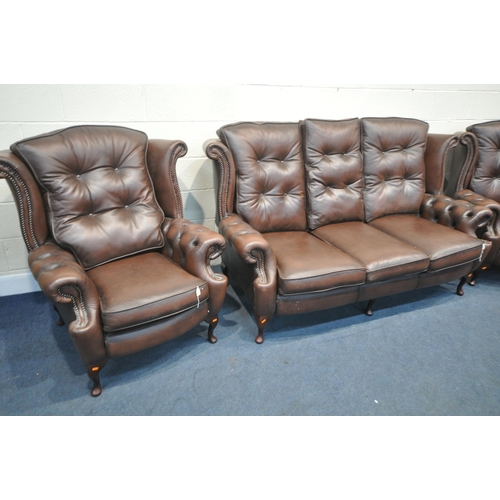 1316 - A DARK BROWN LEATHER THREE PIECE CHESTERFIELD LOUNGE SUITE, comprising a winged three seater settee,... 