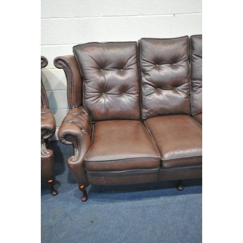 1316 - A DARK BROWN LEATHER THREE PIECE CHESTERFIELD LOUNGE SUITE, comprising a winged three seater settee,... 