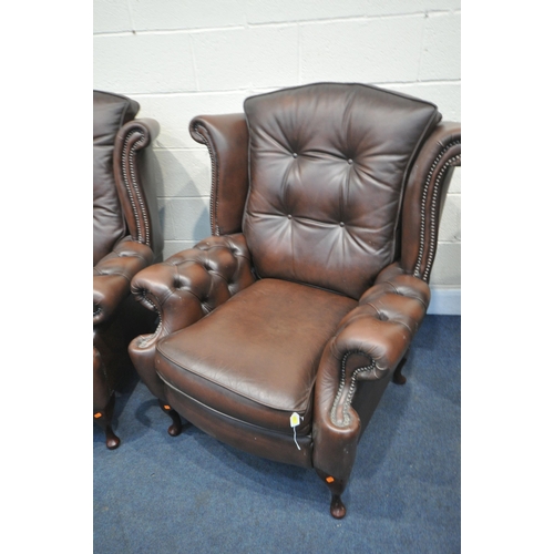 1316 - A DARK BROWN LEATHER THREE PIECE CHESTERFIELD LOUNGE SUITE, comprising a winged three seater settee,... 