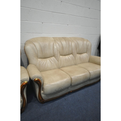 1318 - A WOODEN FRAMED AND CREAM LEATHER TWO PIECE LOUNGE SUITE, labelled Bardi Italy, comprising a three s... 