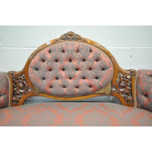 1319 - A VICTORIAN WALNUT BUTTONED SOFA, with open foliate decoration, on scrolled front legs, length 185cm... 