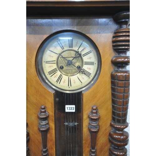 1322 - A 19TH CENTURY WALNUT VIENNA WALL CLOCK, with an eagle pediment and roman numerals, height 135cm (co... 