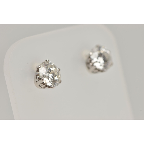 1 - A PAIR OF 18CT WHITE GOLD DIAMOND STUD EARRINGS, each round brilliant cut diamond in a six claw sett... 