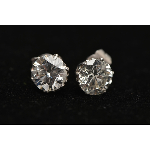 1 - A PAIR OF 18CT WHITE GOLD DIAMOND STUD EARRINGS, each round brilliant cut diamond in a six claw sett... 