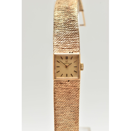 10 - A LADYS 9CT GOLD 'OMEGA' WRISTWATCH, manual wind, gold square dial signed 'Omega', baton markers, po... 