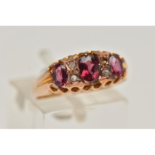 23 - AN EARLY 20TH CENTURY RUBY AND DIAMOND RING, set with three graduated oval cut rubies, interspaced w... 