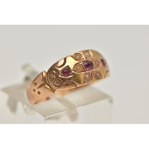 27 - A LATE VICTORIAN 15CT GOLD RUBY AND PEARL RING, flower detail to the centre set with a central ruby ... 