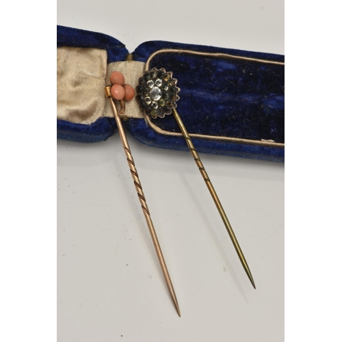 36 - TWO YELLOW METAL STICK PINS, the first set with coral cabochons, unmarked pin, the second of a circu... 