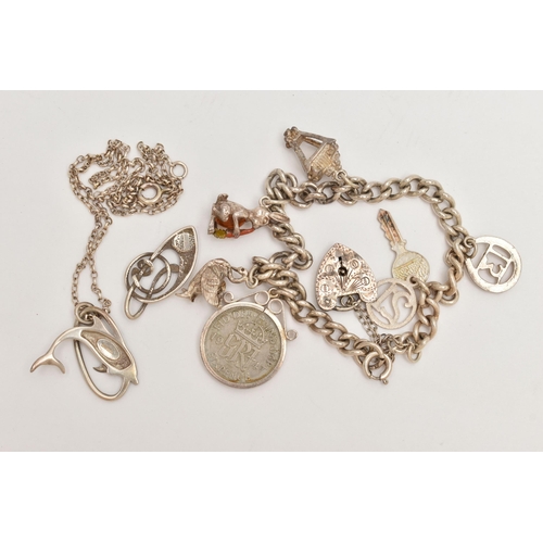 38 - A CHARM BRACELET, TWO PENDANTS AND A CHAIN, the silver curb link bracelet, fitted with six charms in... 