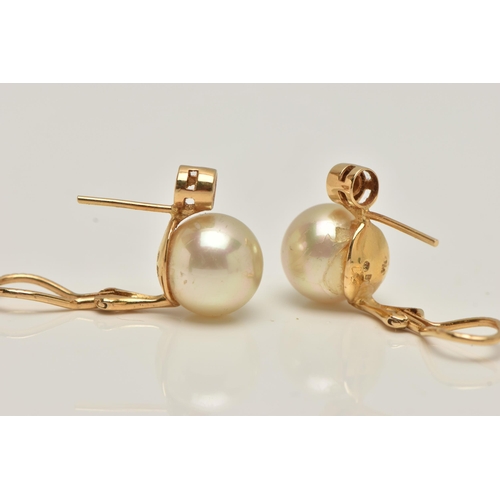 46 - A PAIR OF IMITATION PEARL AND DIAMOND EARRINGS, each designed as a brilliant cut diamond above an im... 