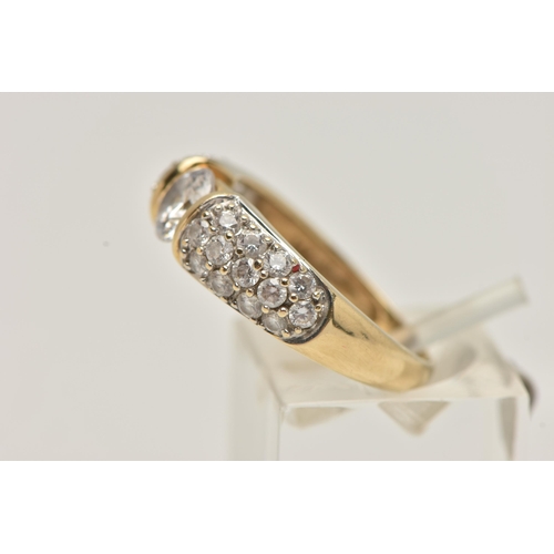 47 - A 14CT GOLD CUBIC ZIRCONIA RING, designed as a central circular colourless cubic zirconia flanked by... 